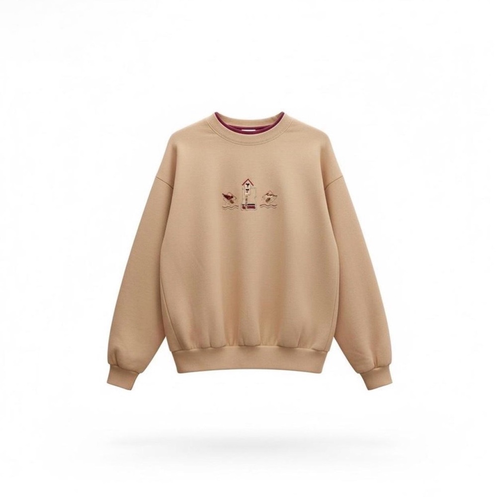 Woman’s Crewneck Sweatshirt in Light Tan with Embroidered Motif